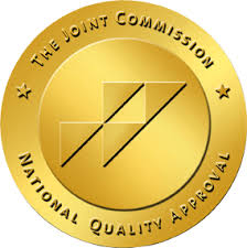 Gold emblem of The Joint Commission.