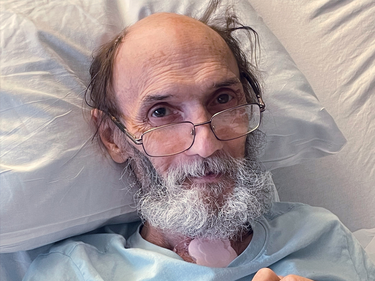 Frank Sykes recovers in his bed.